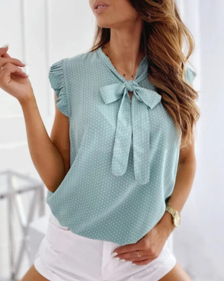 Elegante ärmellose Bluse mit Rüschen und Schleifendetail